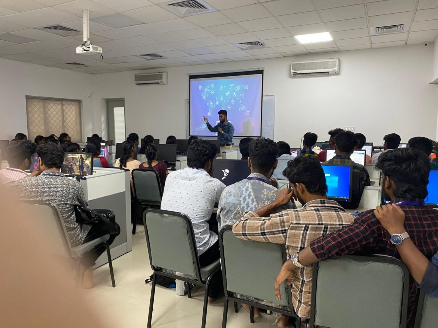 Learners attending an instructor-led session in a computer laboratory