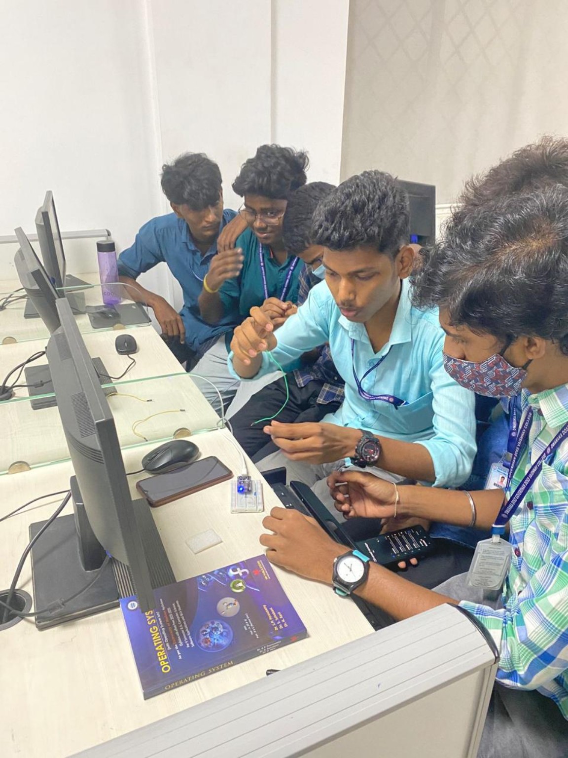 Learners collaborating on an electronics activity at computers during a Codexaon workshop